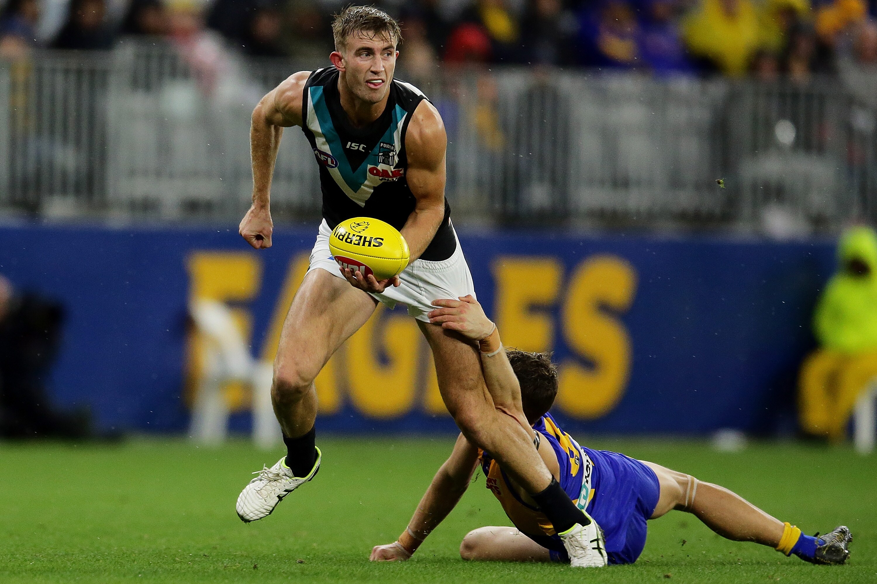AFL 2019 Round 05 - West Coast v Port Adelaide PERTH, AUSTRALIA - APRIL 19: Dougal Howard of the Power handpasses the ball during the 2019 AFL round 05 match between the West Coast Eagles and the Port Adelaide Power at Optus Stadium on April 19, 2019 in Perth, Australia. (Photo by Will Russell/AFL Photos)